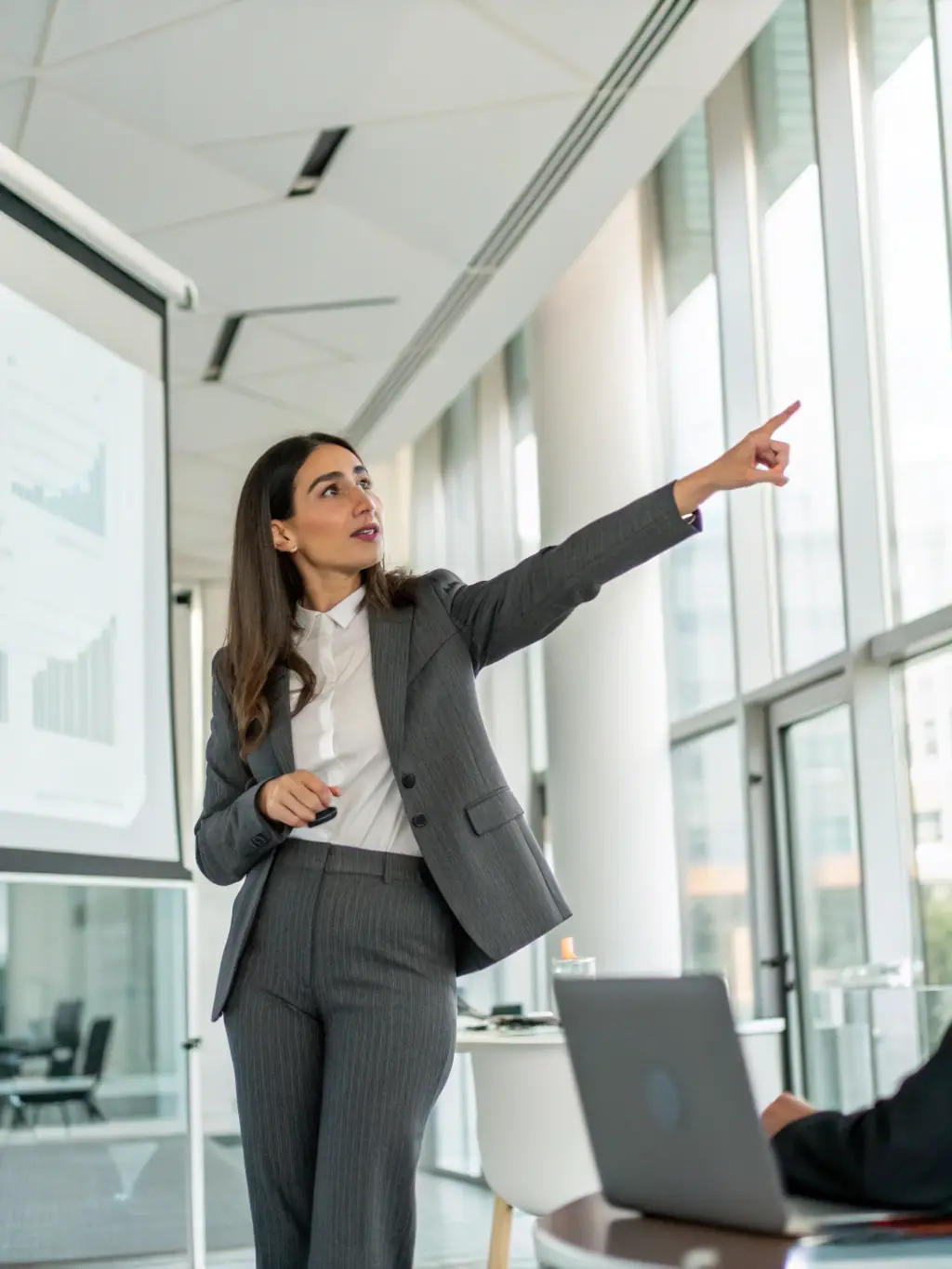 A senior IT consultant presenting a strategic plan to a client, highlighting the value of Strikeworks' expertise in guiding technology initiatives.